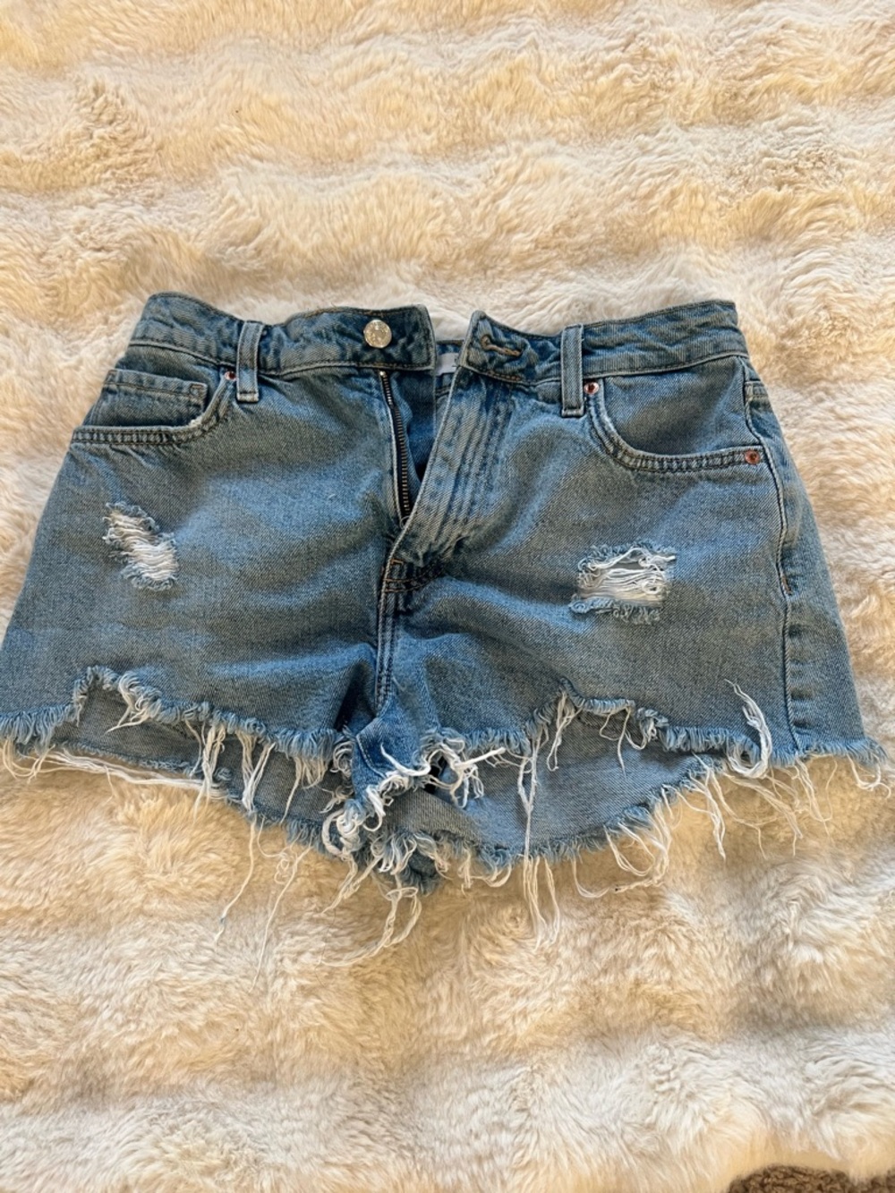 Distressed High-Rise Denim Shorts in Light Blue